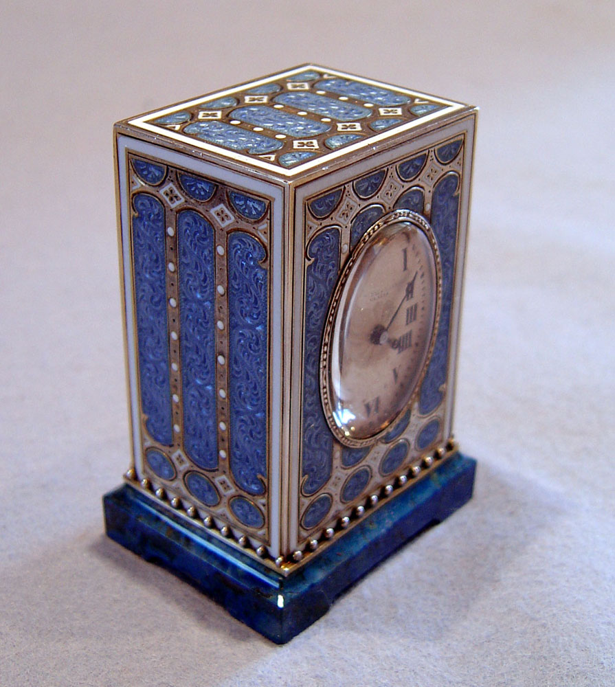 Cased  silver gilt, blue guilloche enamel, jewelled and lapis Lazuli carriage clock.