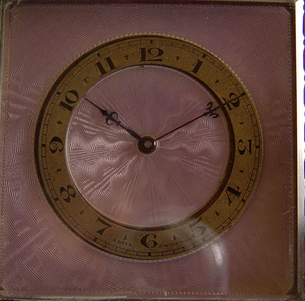 Lilac enamel and gilt bronze strut clock in original case.