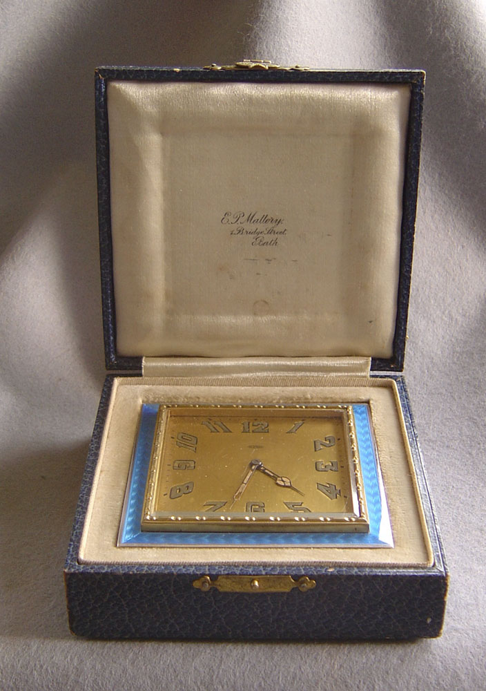Blue guilloche  enamel and silver strut clock in original case.