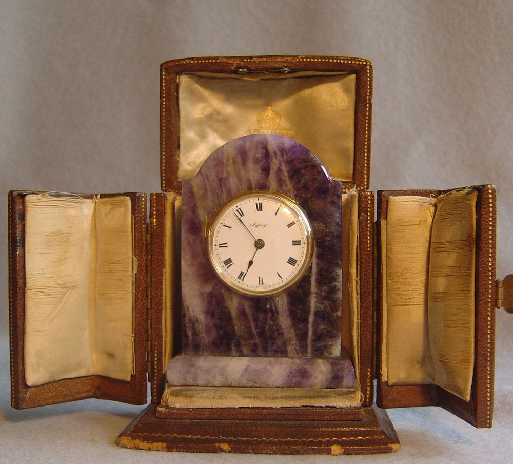 Silver gilt and amethyst cased Aspreys boudoir clock.