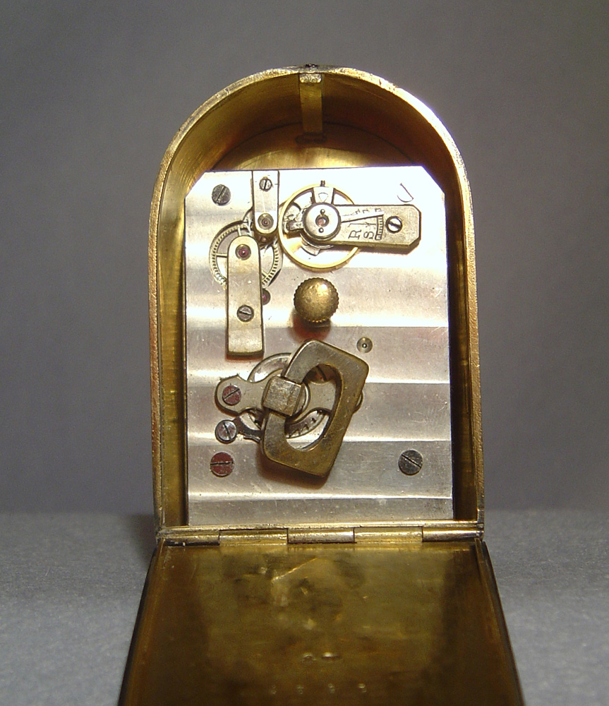 A fine Art Deco silver gilt and lilac guilloche enamel boudoir clock by Asprey's of London.