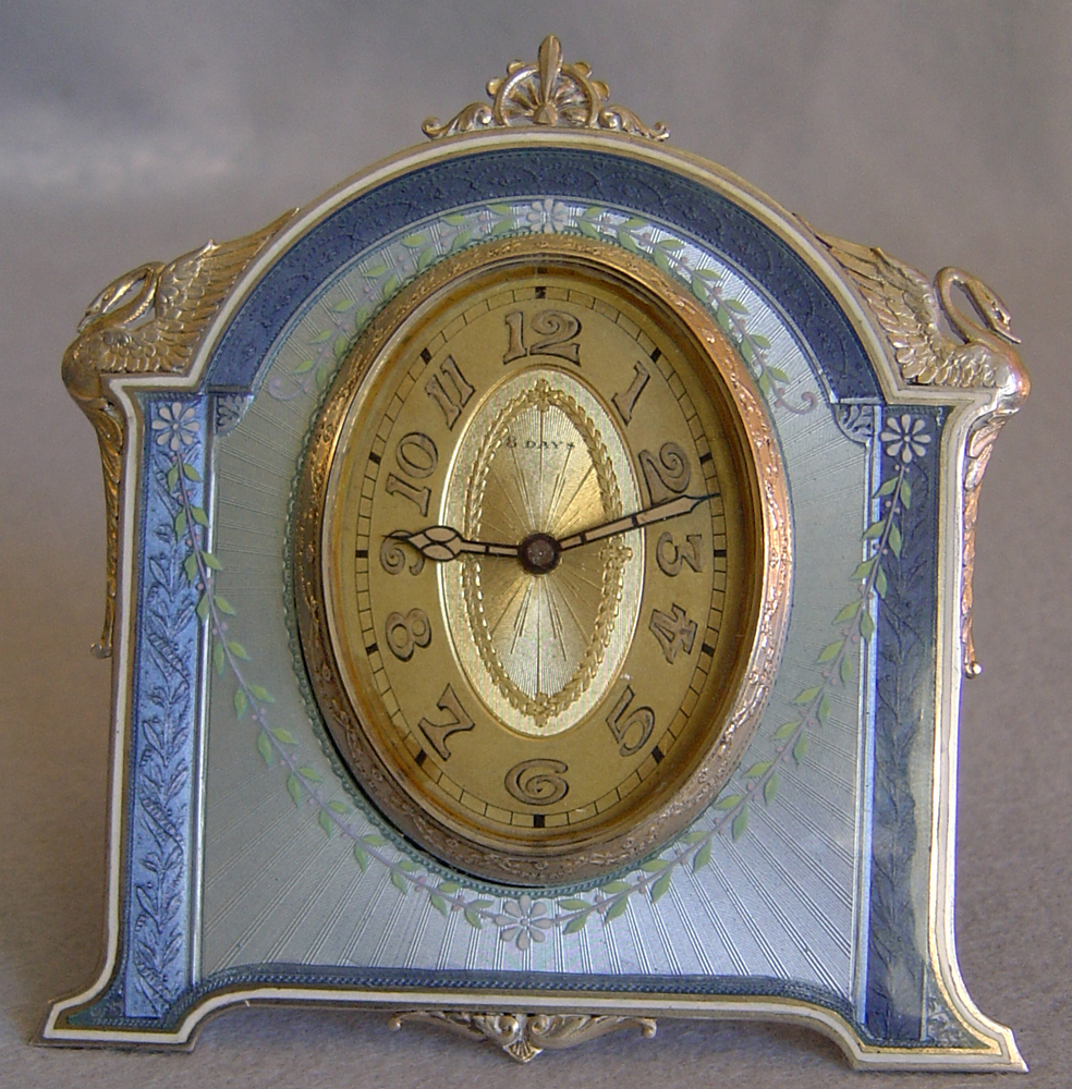 Fine Swiss silver and guilloche enamel strut clock.