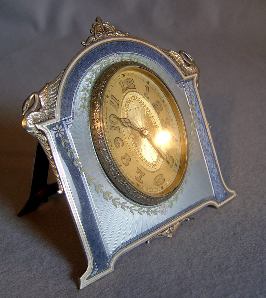 Fine Swiss silver and guilloche enamel strut clock.