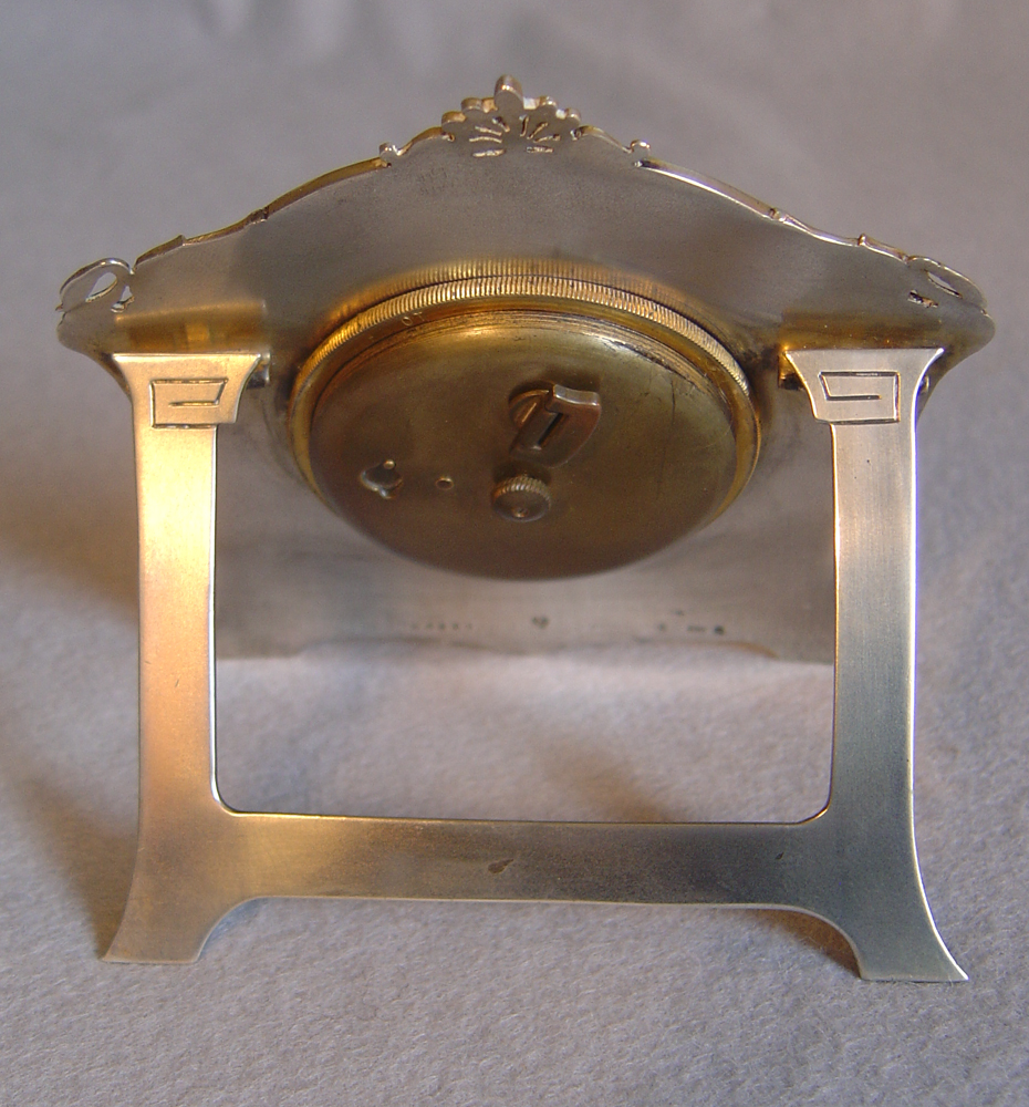 Fine Swiss silver and guilloche enamel strut clock.