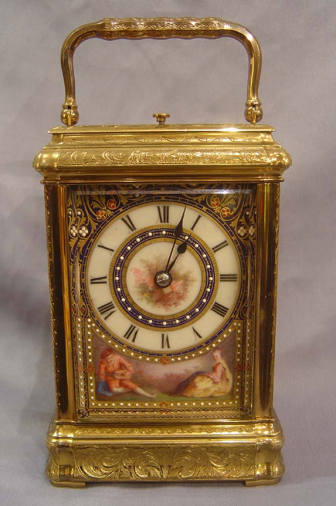 Porcelain panelled carriage clock with engraved 