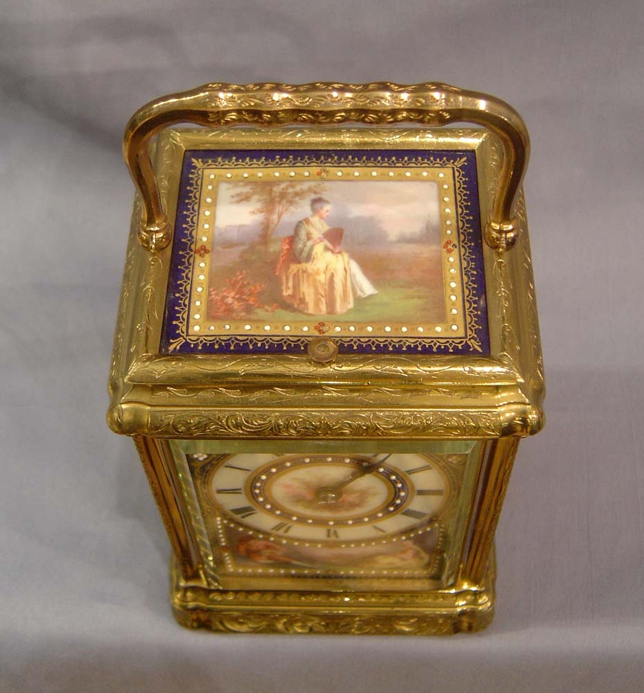 Porcelain panelled carriage clock with engraved 