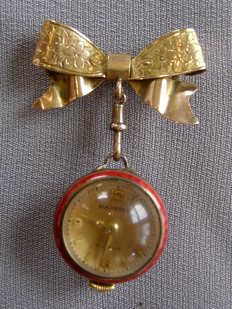 Ladies gold and guilloche enamel brooch watch by Bucherer.