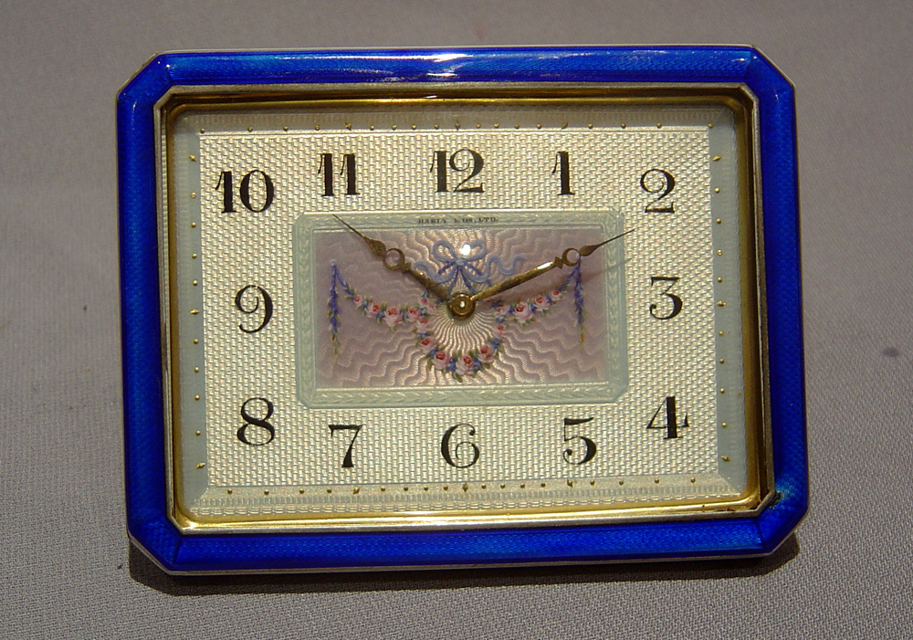A Swiss blue enamel and gilt bronze 8 day strut clock.