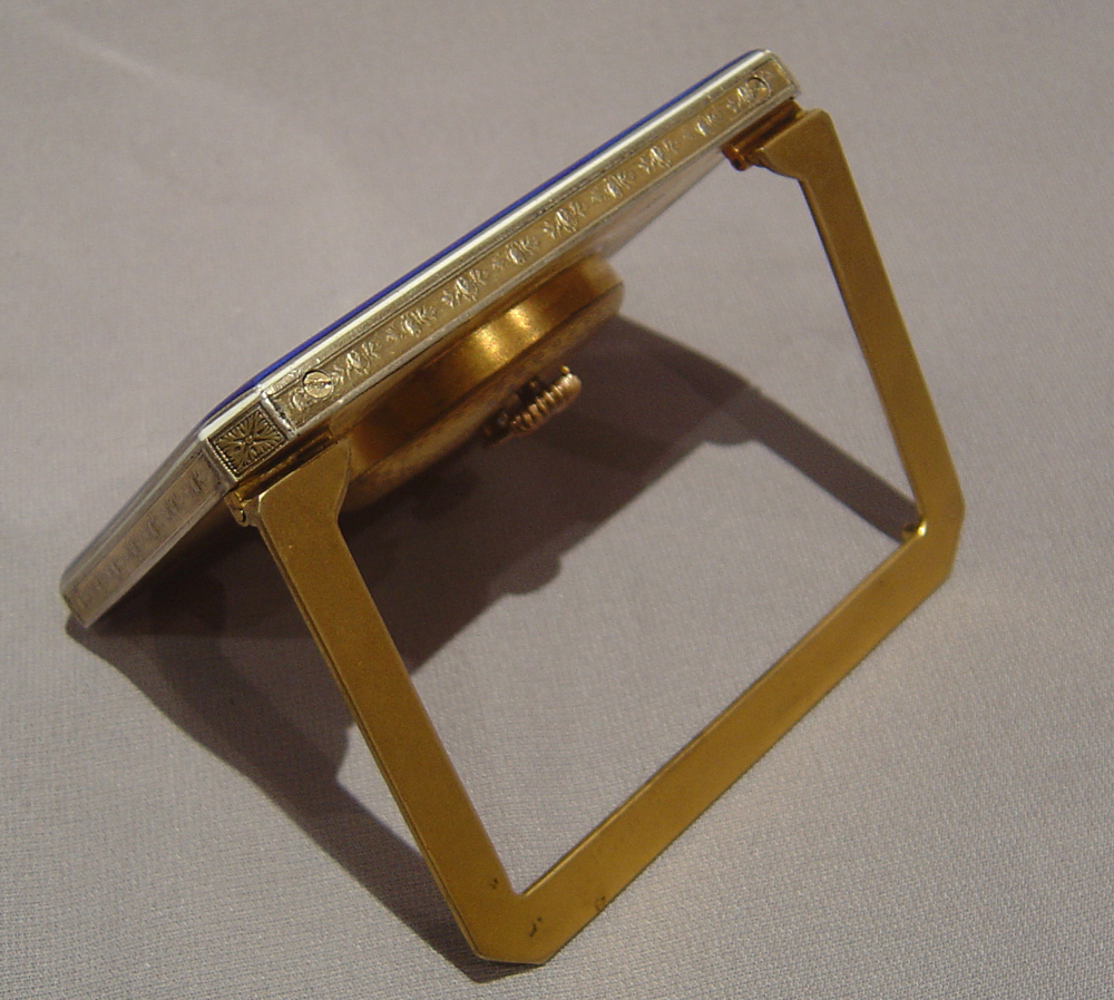 A Swiss blue enamel and gilt bronze 8 day strut clock.