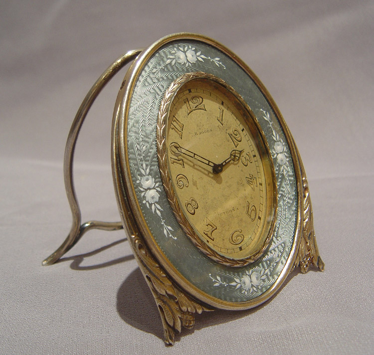 Silver and grey guilloche enamel strut clock with hand painted flowers.