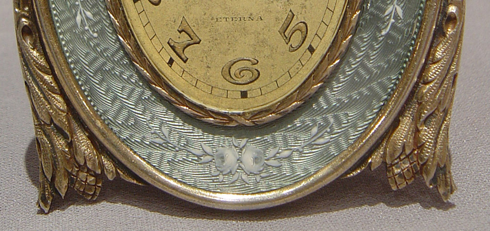 Silver and grey guilloche enamel strut clock with hand painted flowers.