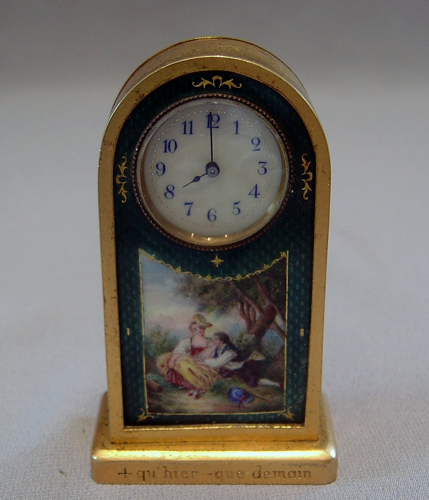 Gilt bronze and enamel miniature carriage clock.