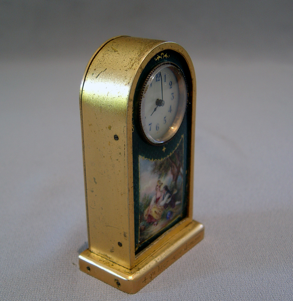 Gilt bronze and enamel miniature carriage clock.