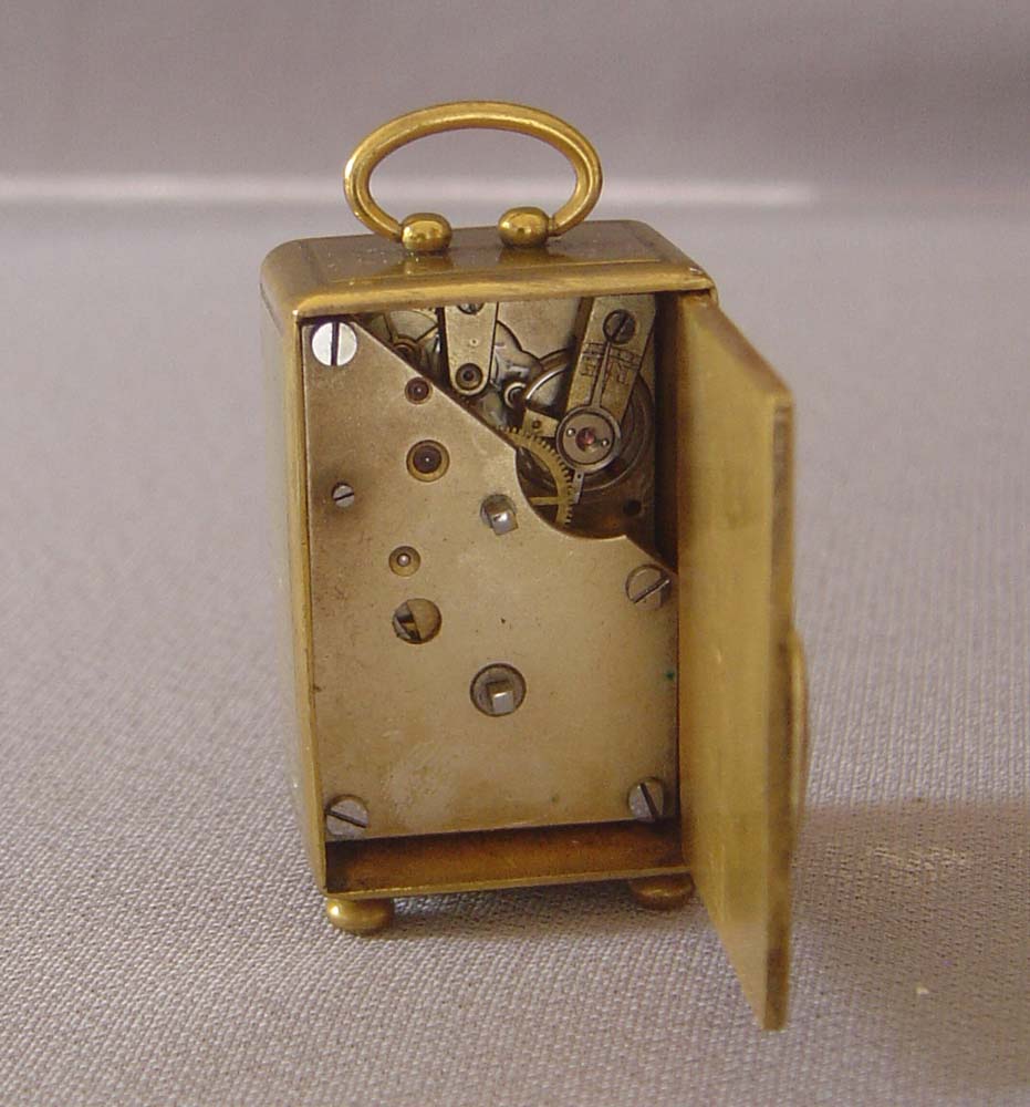 Antique miniature carriage clock in original leather case.