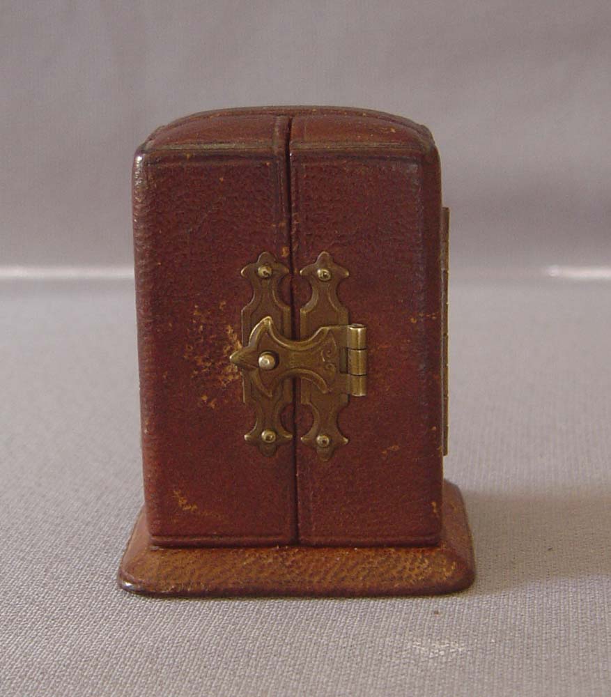 Antique miniature carriage clock in original leather case.