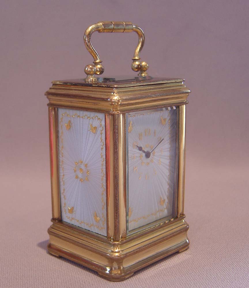 Antique carriage clock with guilloche enamel panels.