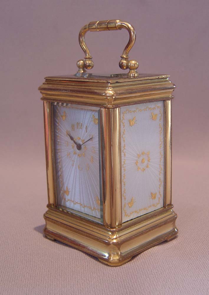 Antique carriage clock with guilloche enamel panels.