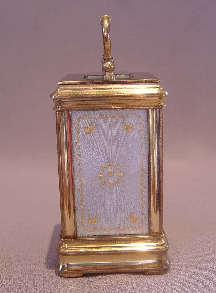 Antique carriage clock with guilloche enamel panels.