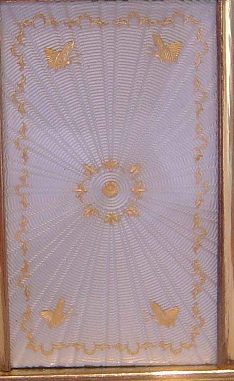 Antique carriage clock with guilloche enamel panels.