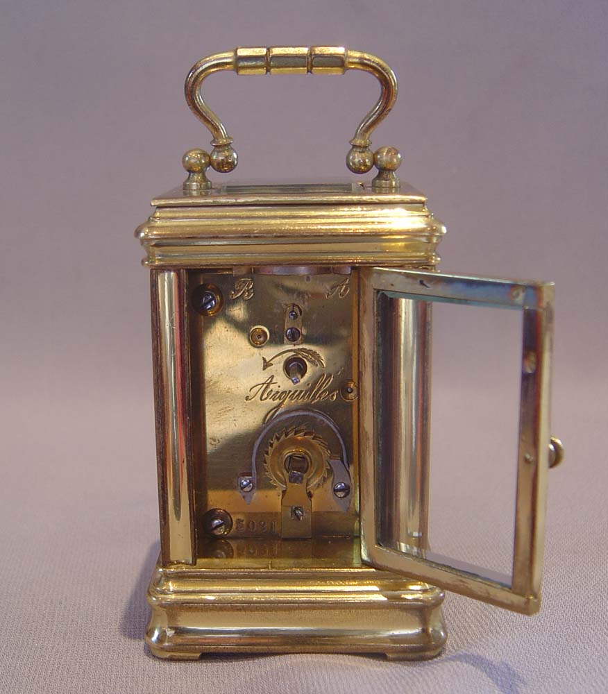 Antique carriage clock with guilloche enamel panels.