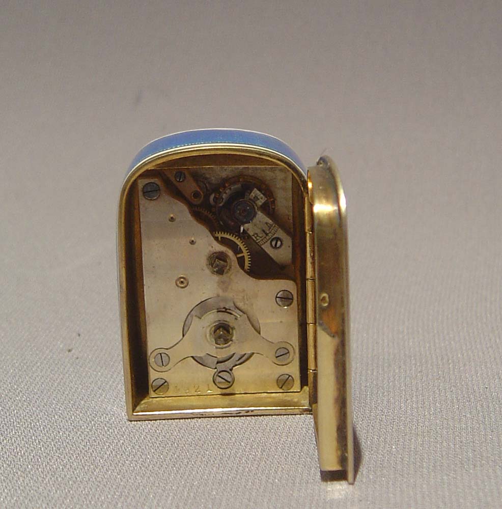 Enamel and silver gilt sub-miniature carriage clock in leather case.