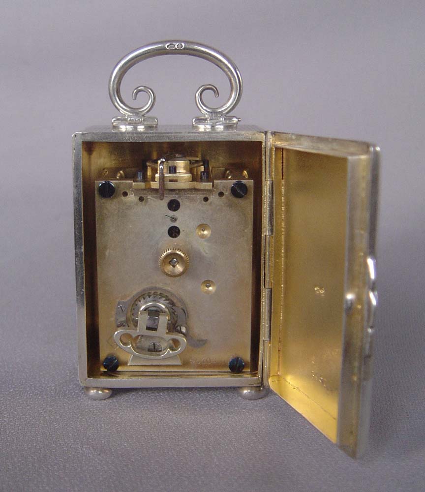 Silver engine turned small carriage clock of exceptional quality.