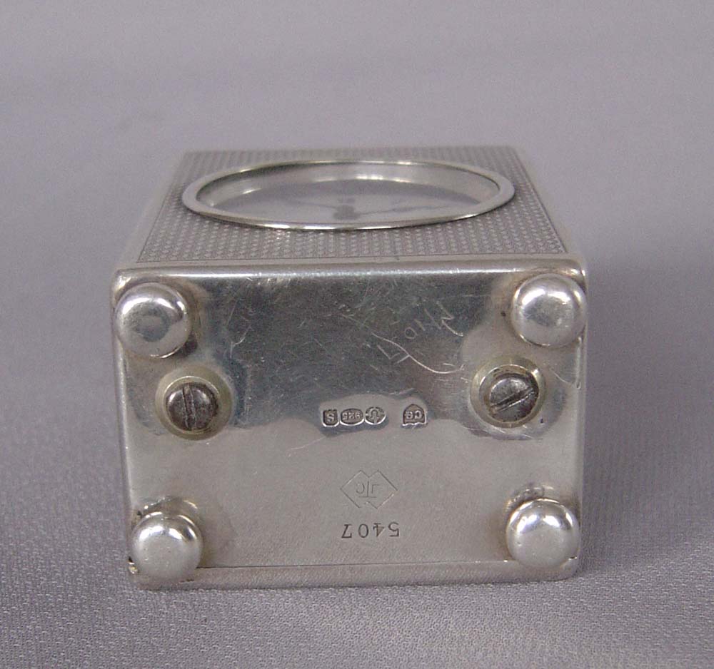 Silver engine turned small carriage clock of exceptional quality.