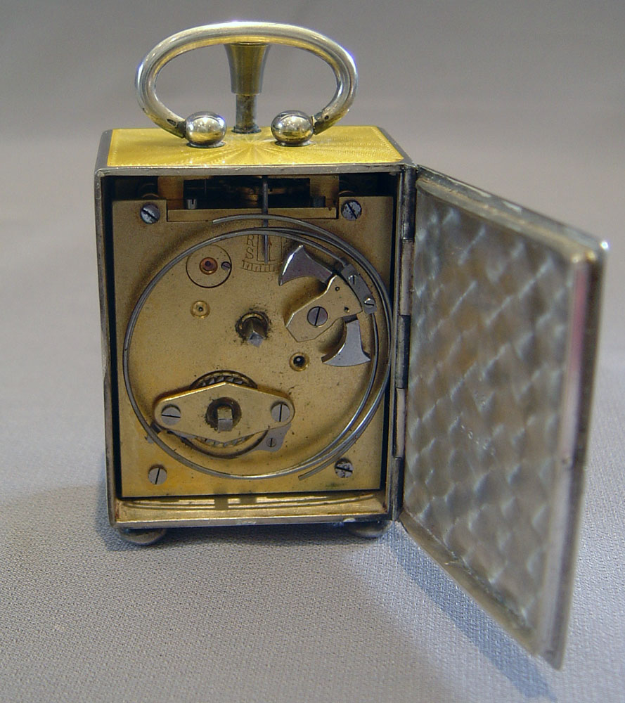 Fine silver and Imperial yellow guilloche enamel 1/4 repeater in carrying case.