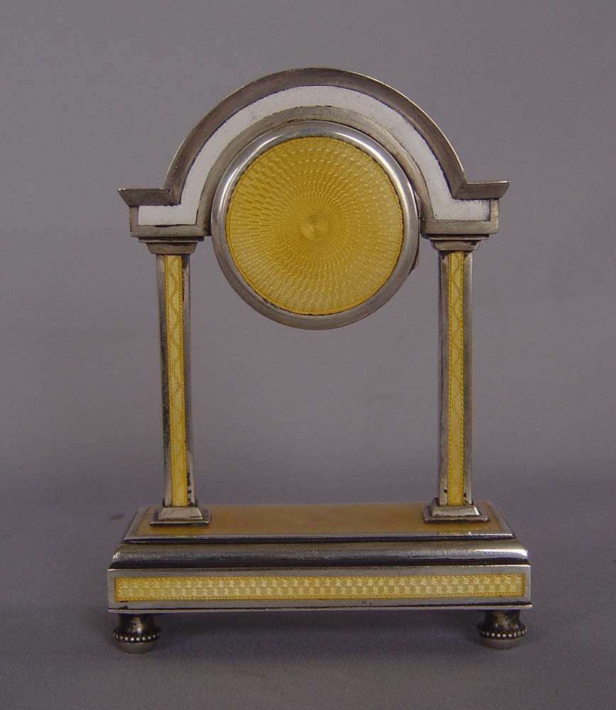 Antique guilloch enamel and silver portico clock.