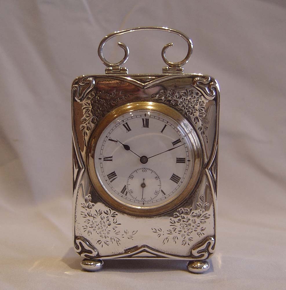 Antique Art Nouveau silver cased carriage clock.
