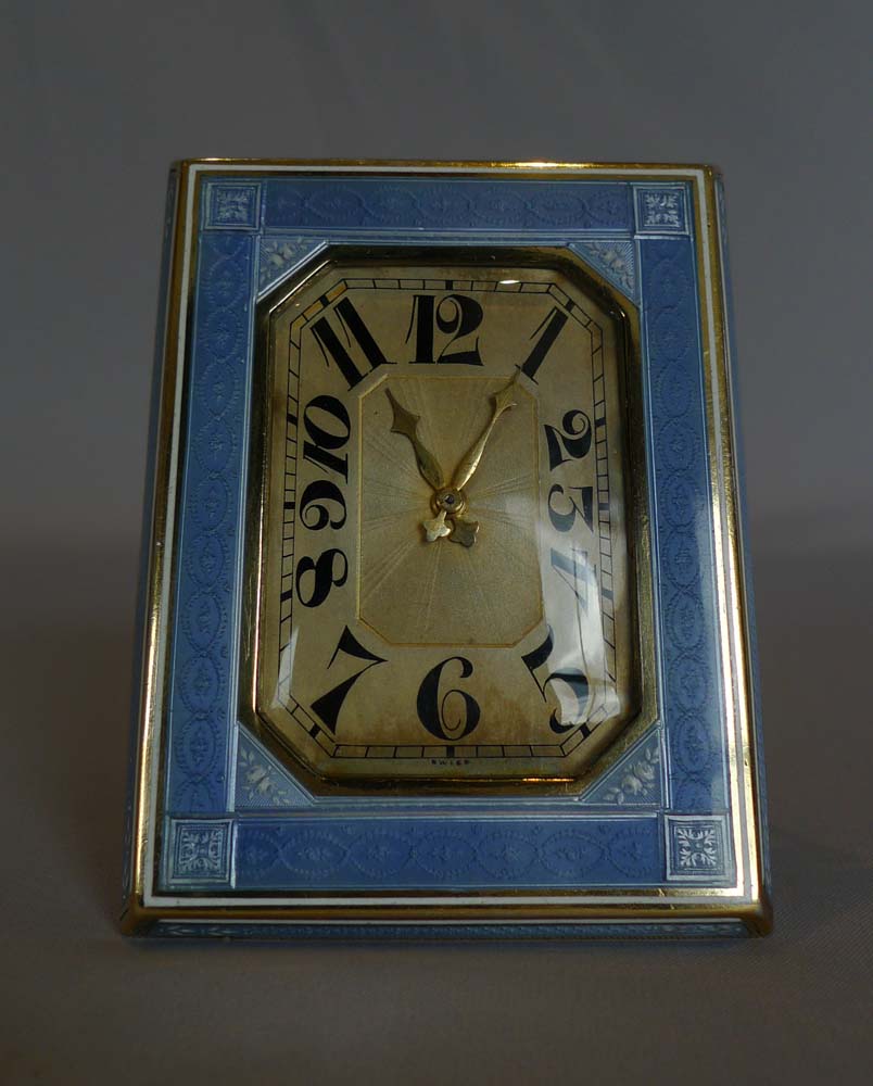 Guilloche enamel and silver, heavy strut clock.