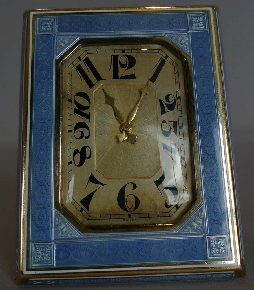 Guilloche enamel and silver, heavy strut clock.