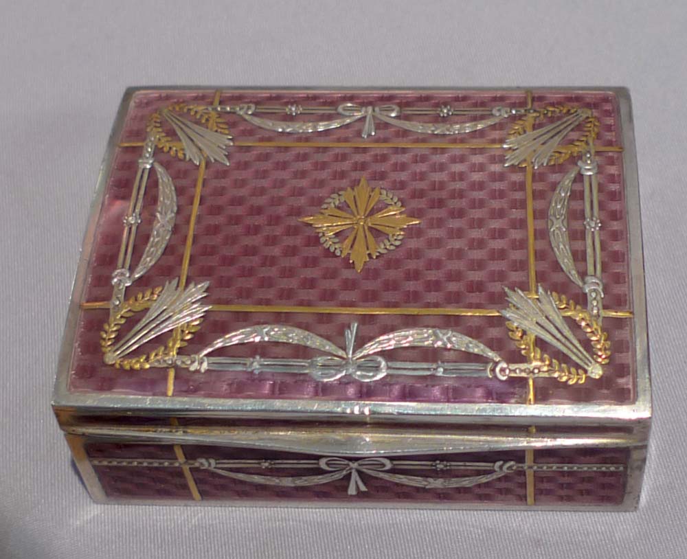 Antique silver and fine guilloche enamel pill box with applied gold mounts.