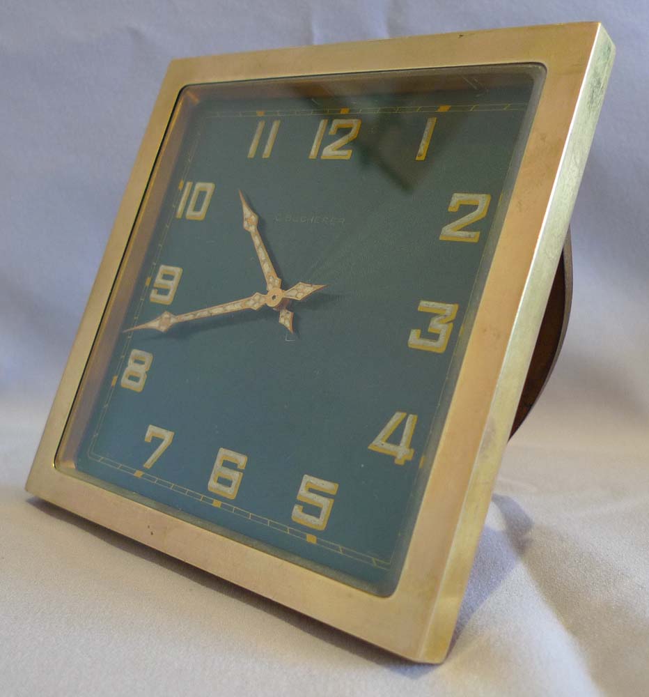 Bucherer gilt bronze and green guilloche enamel strut clock