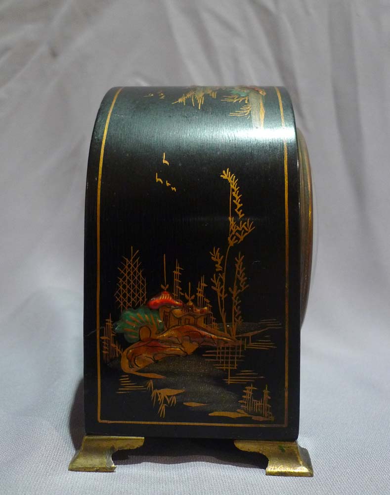 Dome topped black lacquer and chinnoisserie decorated mante clock