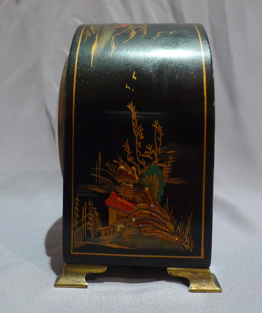 Dome topped black lacquer and chinnoisserie decorated mante clock