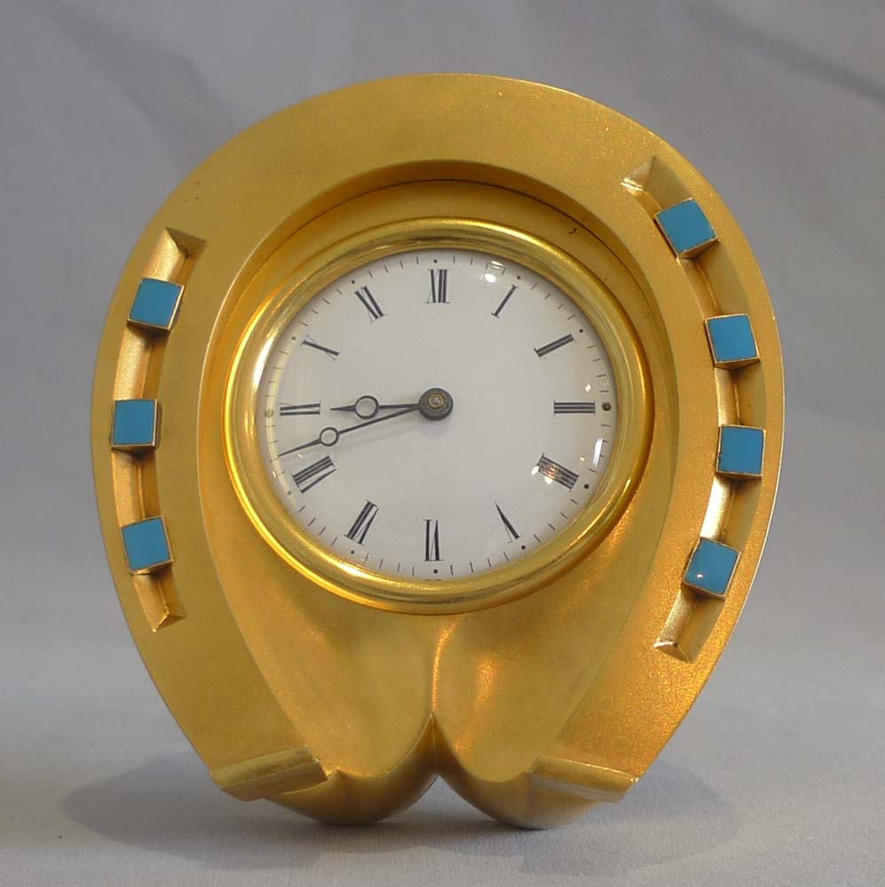Antique enamel and ormolu high quality horseshoe clock in original leather case.