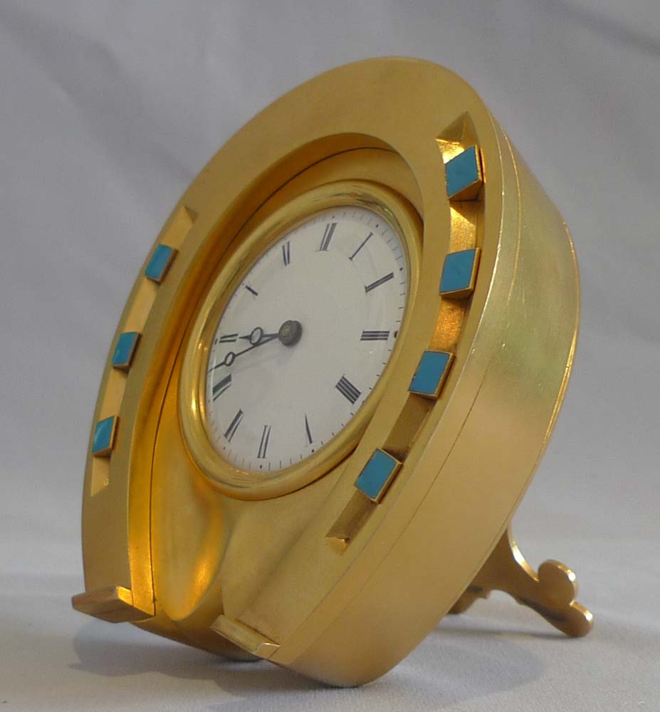 Antique enamel and ormolu high quality horseshoe clock in original leather case.