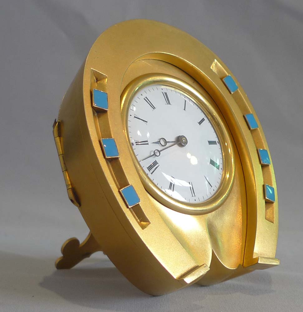 Antique enamel and ormolu high quality horseshoe clock in original leather case.