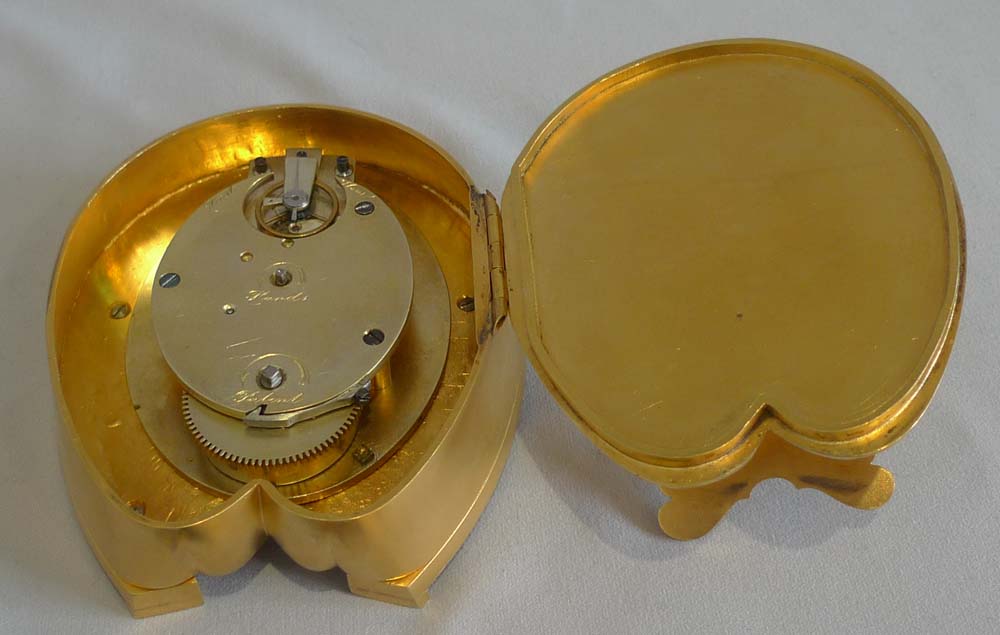 Antique enamel and ormolu high quality horseshoe clock in original leather case.