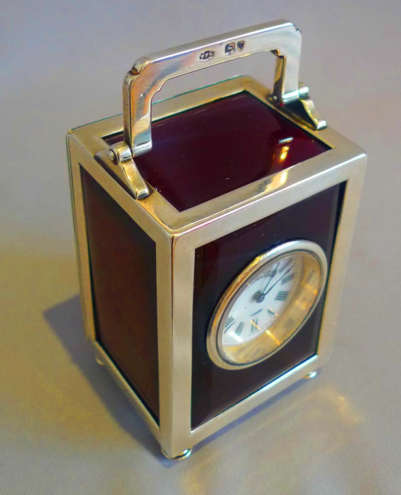 Antique silver and foil backed glass carraige clock by Thornhill & Co