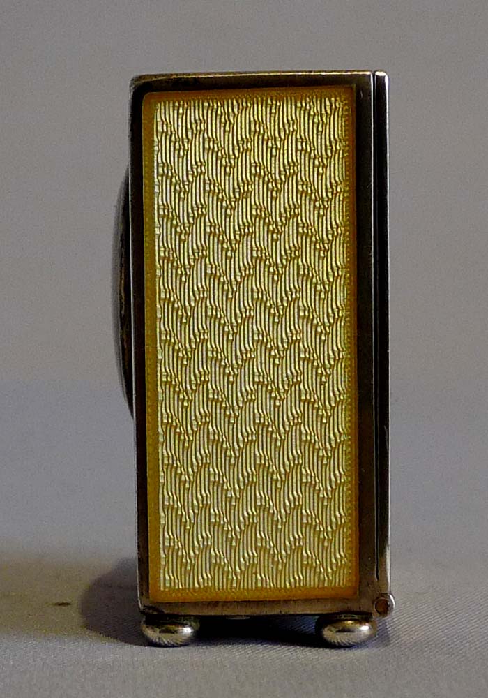 Sub miniature carriage clock in lemon yellow guilloche enamel and silver gilt.