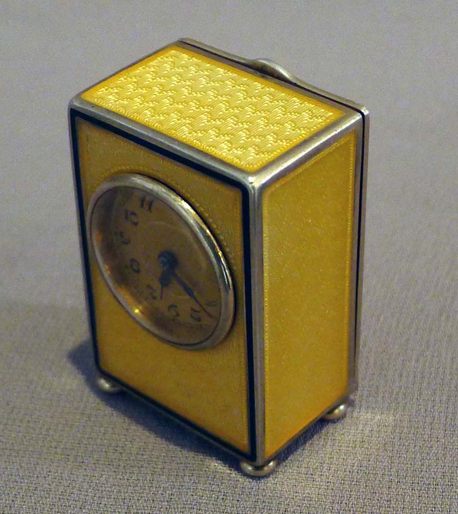 Sub miniature carriage clock in lemon yellow guilloche enamel and silver gilt.