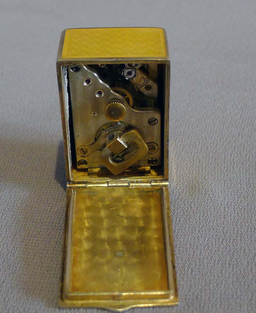 Sub miniature carriage clock in lemon yellow guilloche enamel and silver gilt.