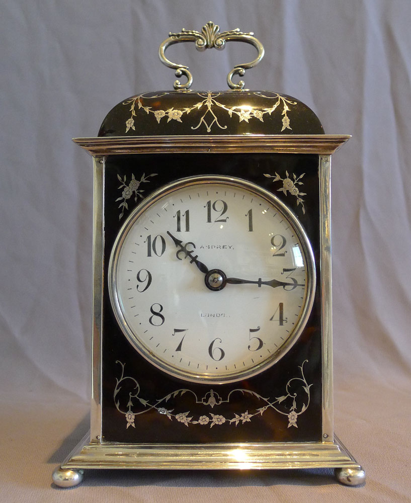 Antique silver and tortoiseshell pique large striking mantel clock signed Asprey.