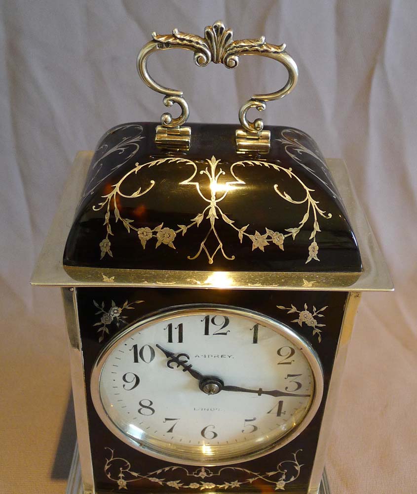 Antique silver and tortoiseshell pique large striking mantel clock signed Asprey.