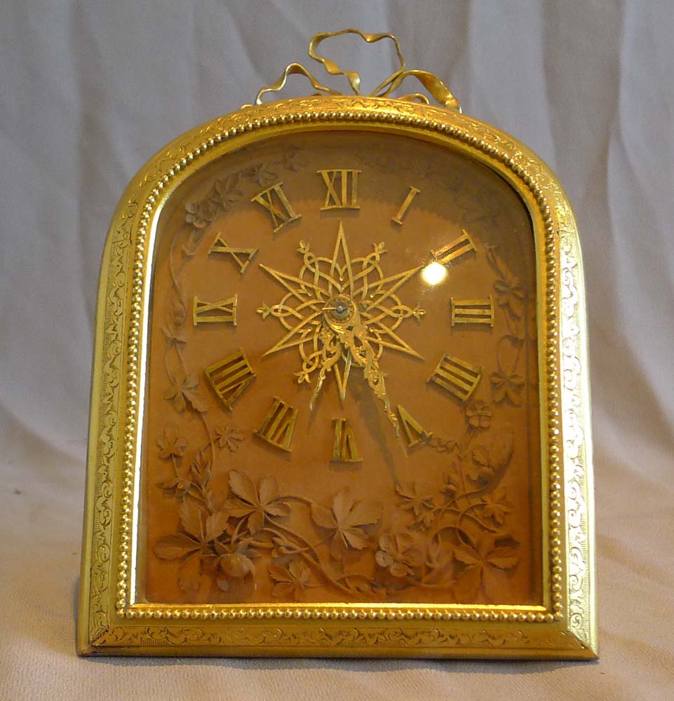 English ormolu mantel clock in manner of Cole by Barry of London with signed carved limewood dial.