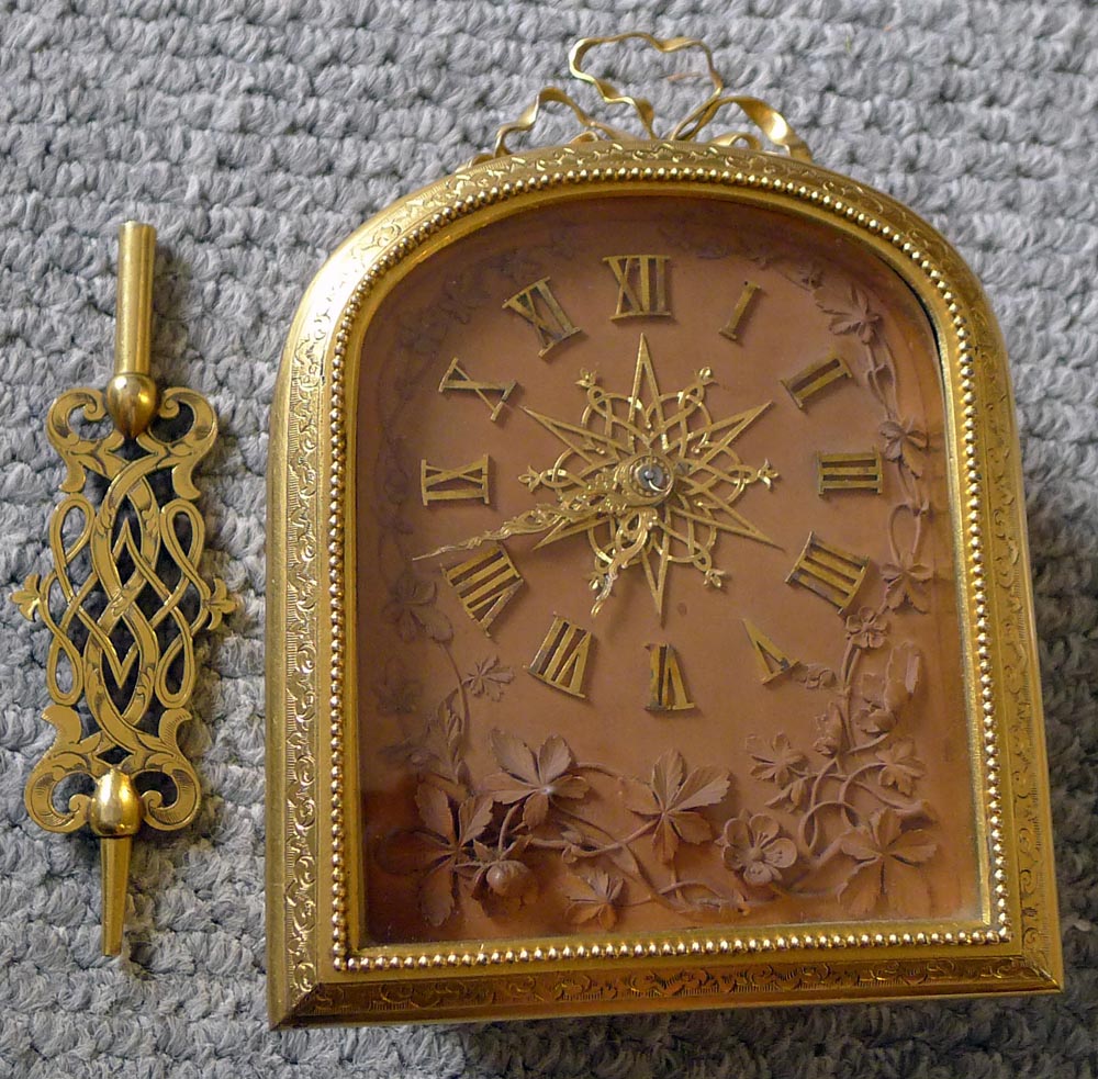 English ormolu mantel clock in manner of Cole by Barry of London with signed carved limewood dial.