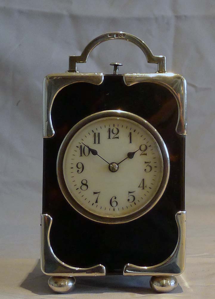 Antique silver mounted tortoiseshell carriage clock with strike and repeat