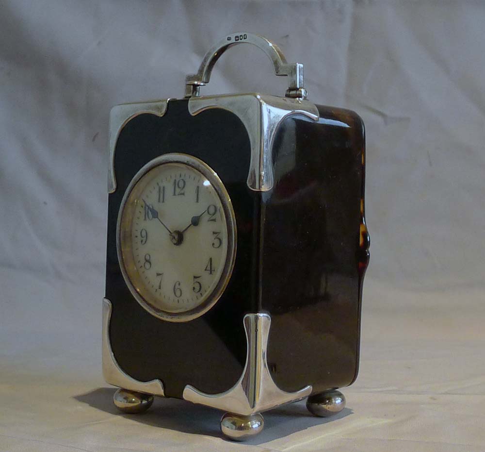Antique silver mounted tortoiseshell carriage clock with strike and repeat